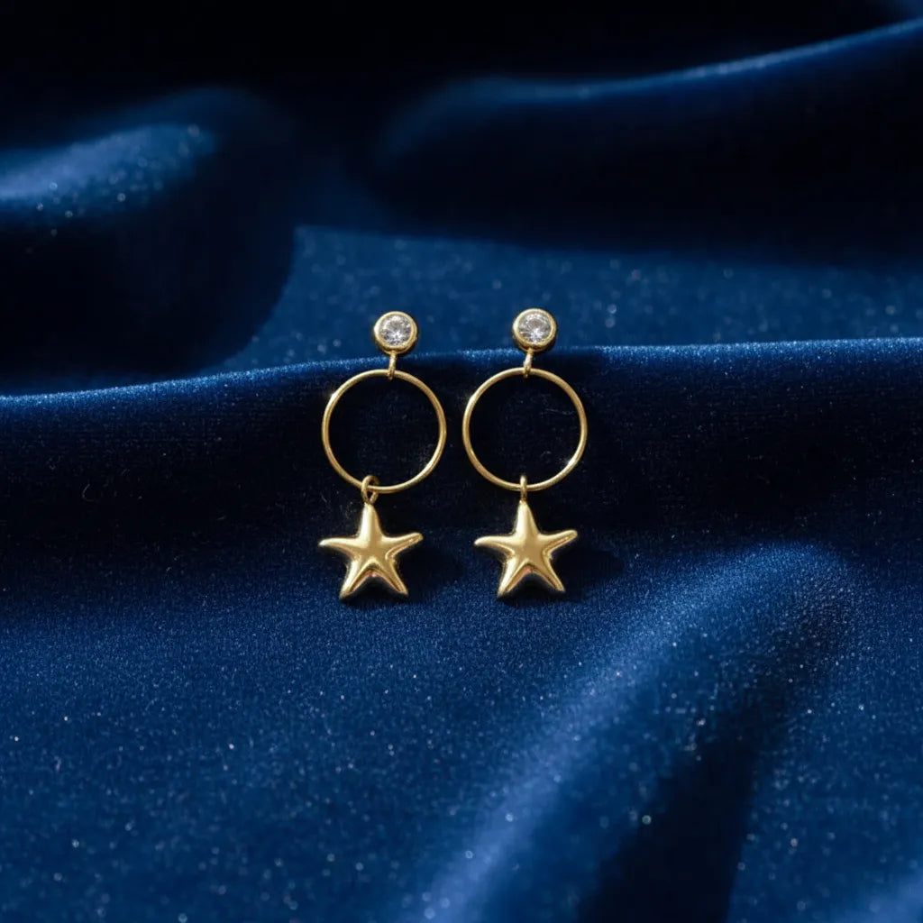 Twinkle Star Drops on a blue fabric background