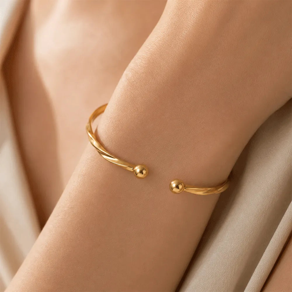 K-A Trends Twirl Gold Cuff Bracelet worn on wrist