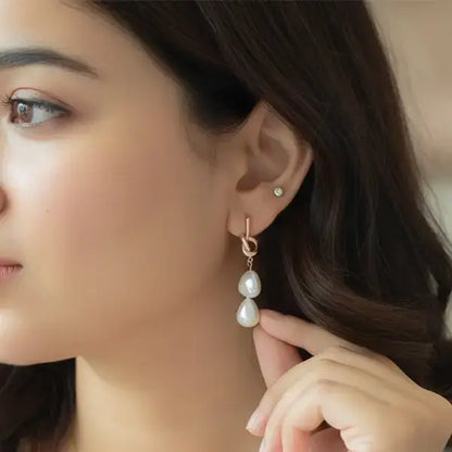 Model wearing rose gold double pearl drop earrings – lightweight anti-tarnish jewellery for daily wear