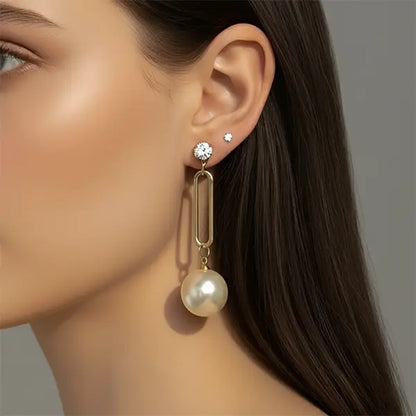 Model wearing Timeless Pearl Drops earrings – elegant long pearl dangle design, lightweight