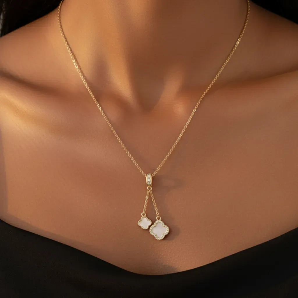 Gold Duo Clover Pendant Necklace with Anti-Tarnish finish and Mother-of-Pearl inlay. A delicate Y-drop style charm necklace.