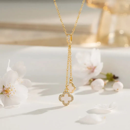Gold Duo Clover Pendant Necklace with Anti-Tarnish finish and Mother-of-Pearl inlay. A delicate Y-drop style charm necklace. 