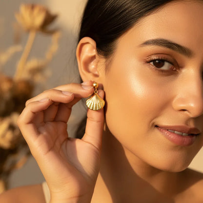 Anti-tarnish gold shell drop earrings. Beach jewelry, fan-shaped shell pendant.